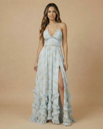 Front view of pale blue floral halter maxi dress with slit and layered ruffle skirt