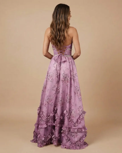 Back view of lavender floral halter maxi dress with crisscross lace-up back and bow tie