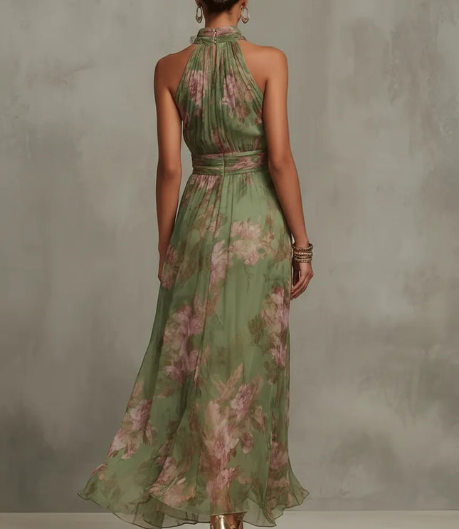 Back view of women floral halter maxi dress in green sheer fabric with pink blossoms