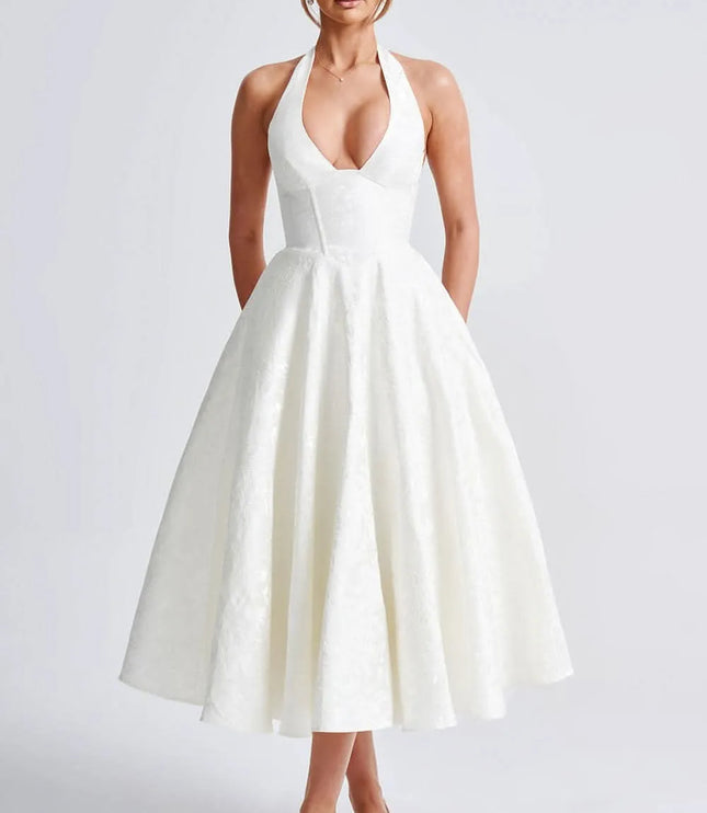 White floral halter midi wedding guest dress with deep V neckline and voluminous skirt