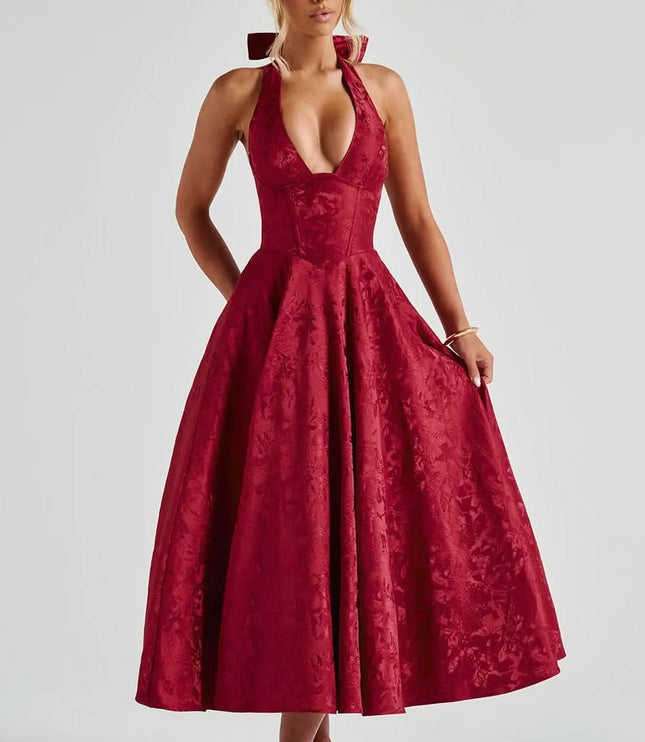 Deep red floral halter midi wedding guest dress with full skirt and fitted waist