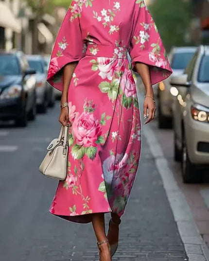 Pink floral kimono sleeve midi dress with belted waist and flowing hem