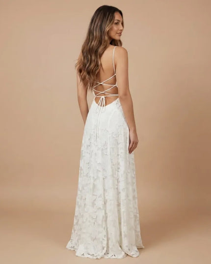 Back view of white floral lace maxi dress with crisscross straps and open back design