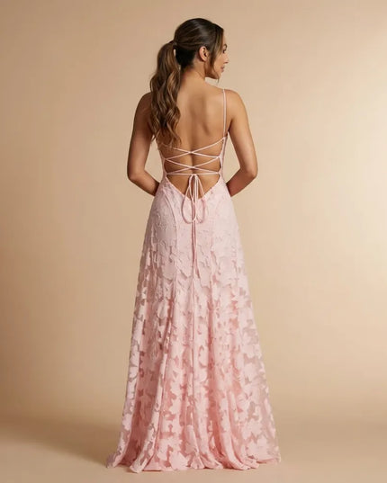 Back view of blush floral lace maxi dress with crisscross straps and open back detail