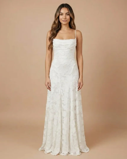 White floral lace spaghetti strap maxi dress with straight neckline and long flowing skirt
