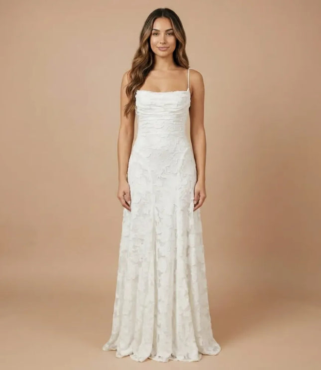 White floral lace spaghetti strap maxi dress with straight neckline and long flowing skirt