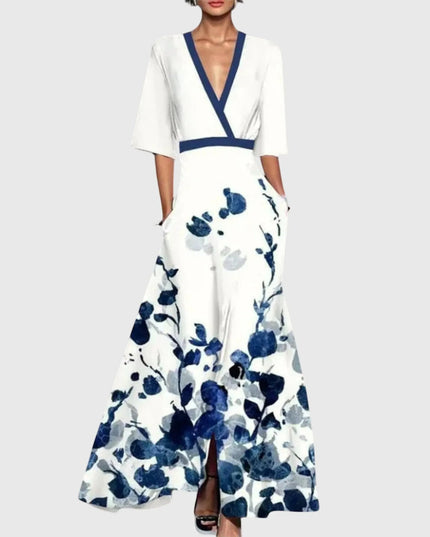 Women printed V neck maxi dress with white base, navy floral print, and long flared skirt
