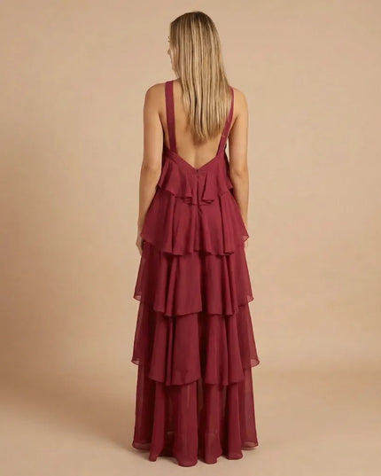 Back view of burgundy halter tiered maxi dress with deep open back and tiers