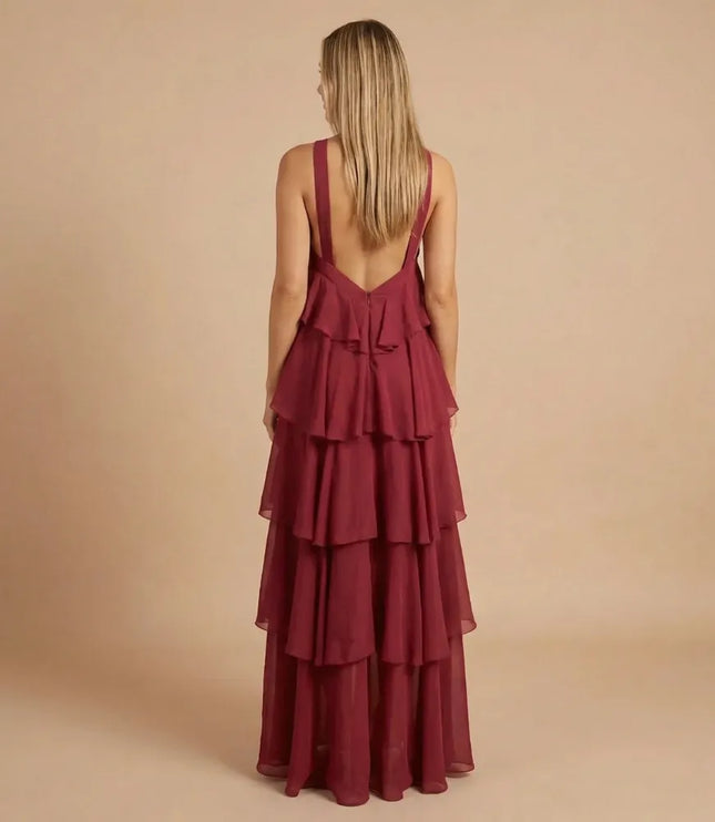 Back view of burgundy halter tiered maxi dress with deep open back and tiers